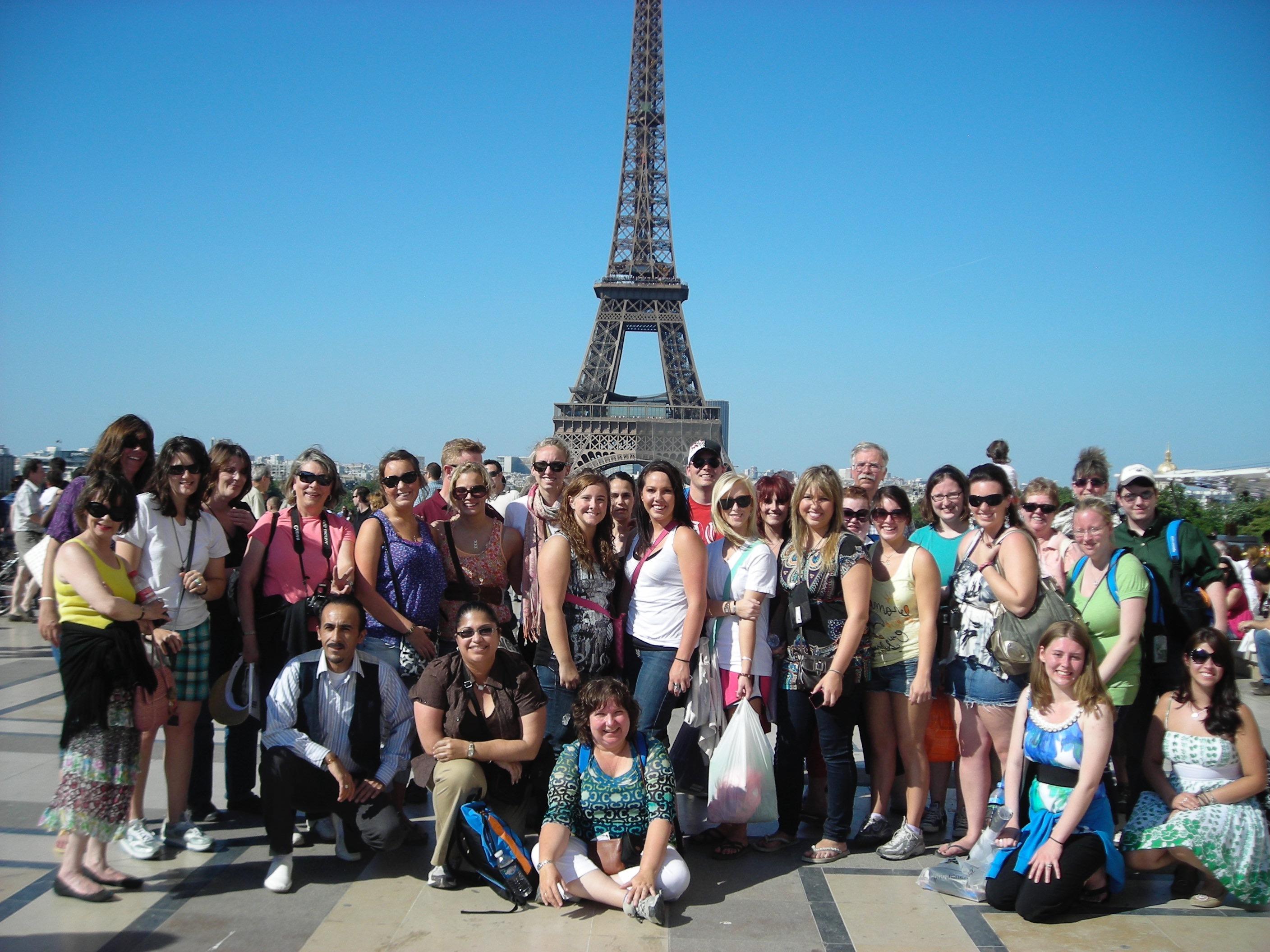 Holy Family University students post in front of the Eiffel Tower in Paris, France
